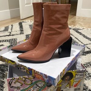 Slightly worn into has 2 hardly noticeable scratches, overall great quality!